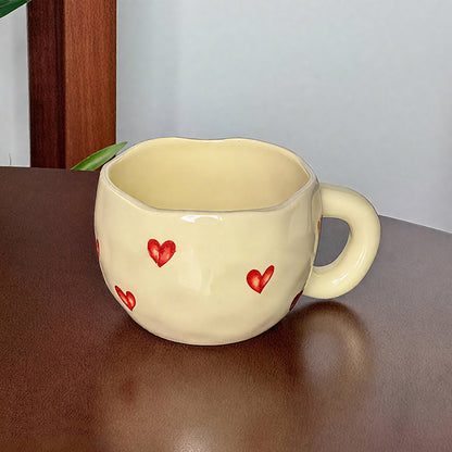Ceramic cup with red heart and handle