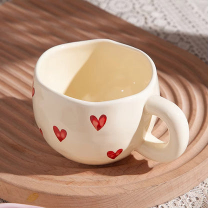 Ceramic cup with red heart and handle